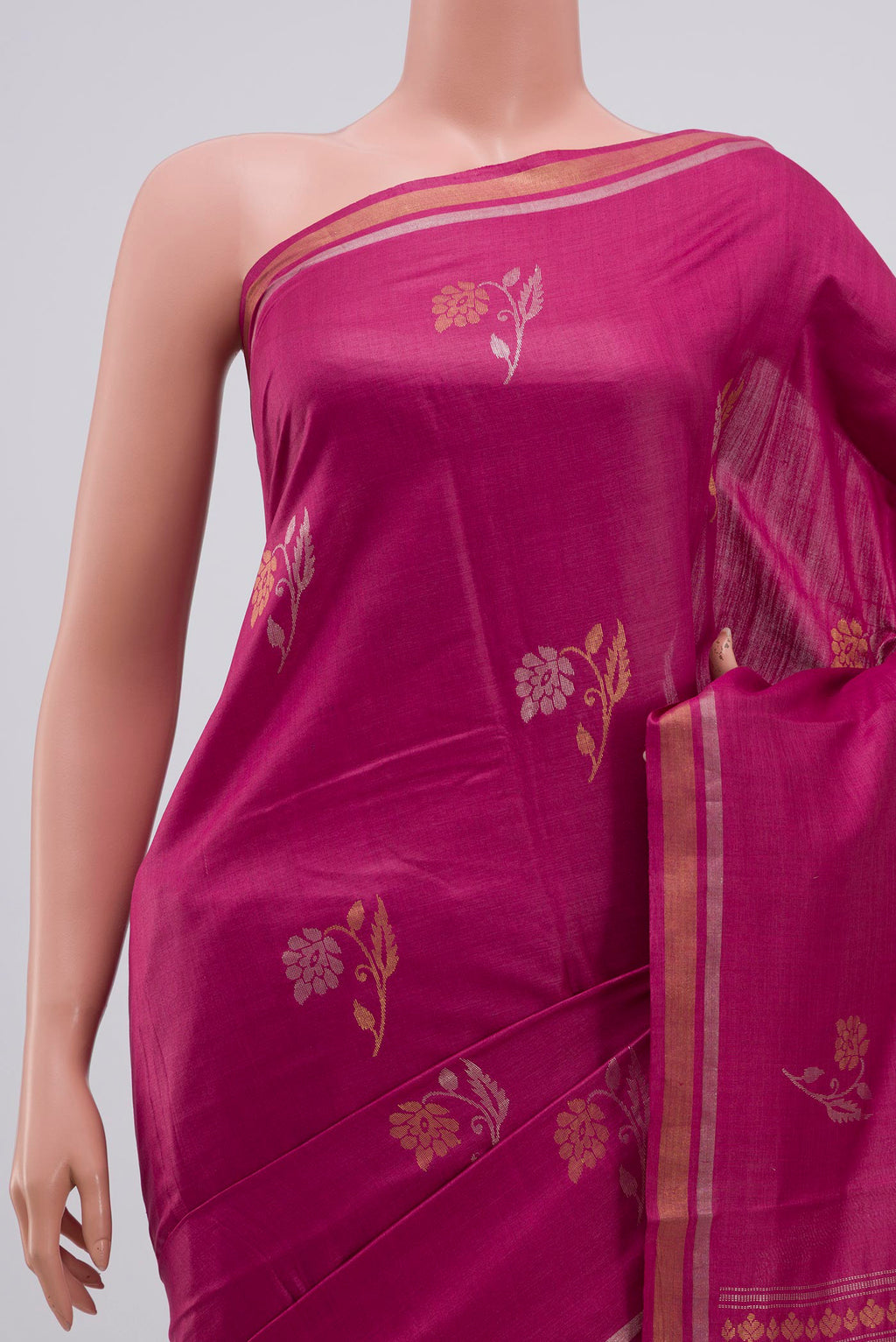Border image of Pink Tussar Saree with Zari Butta on the body and Thin Zari Line. 