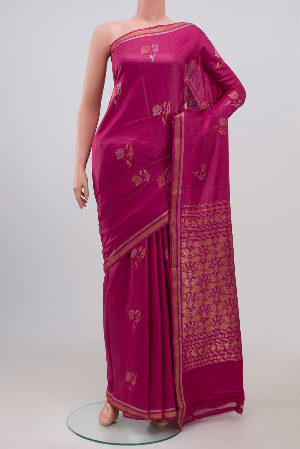 Pink Tussar Saree with Zari Butta on the body and Thin Zari Line.  displayed on a mannequin