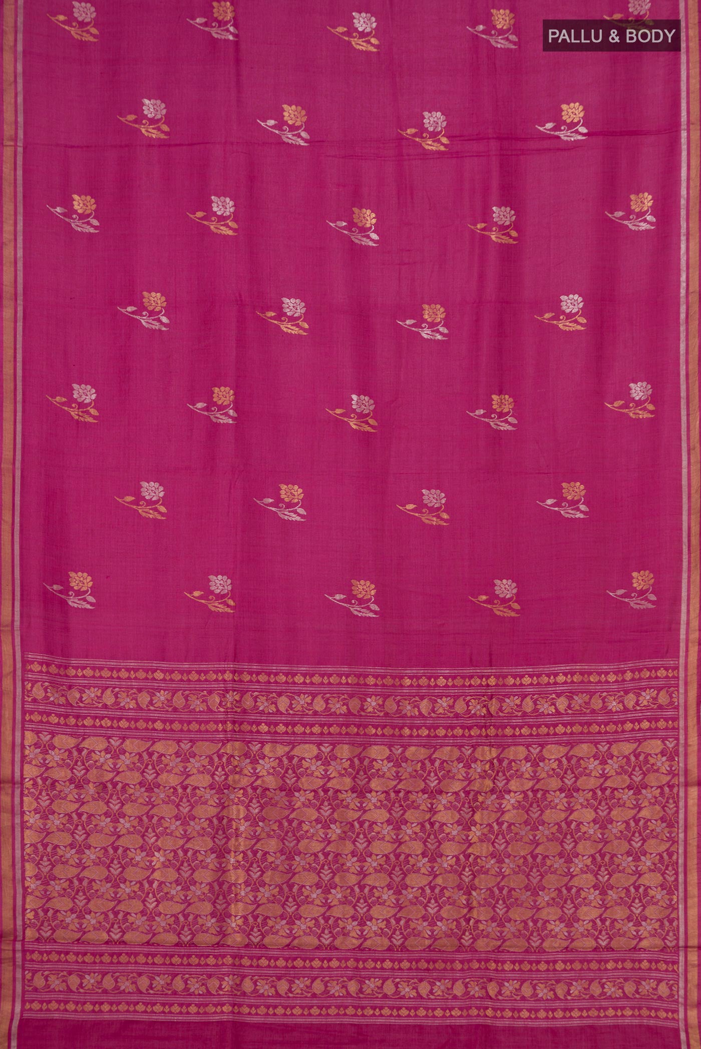 Flat view of Pink Tussar Saree with Zari Butta on the body and Thin Zari Line. 