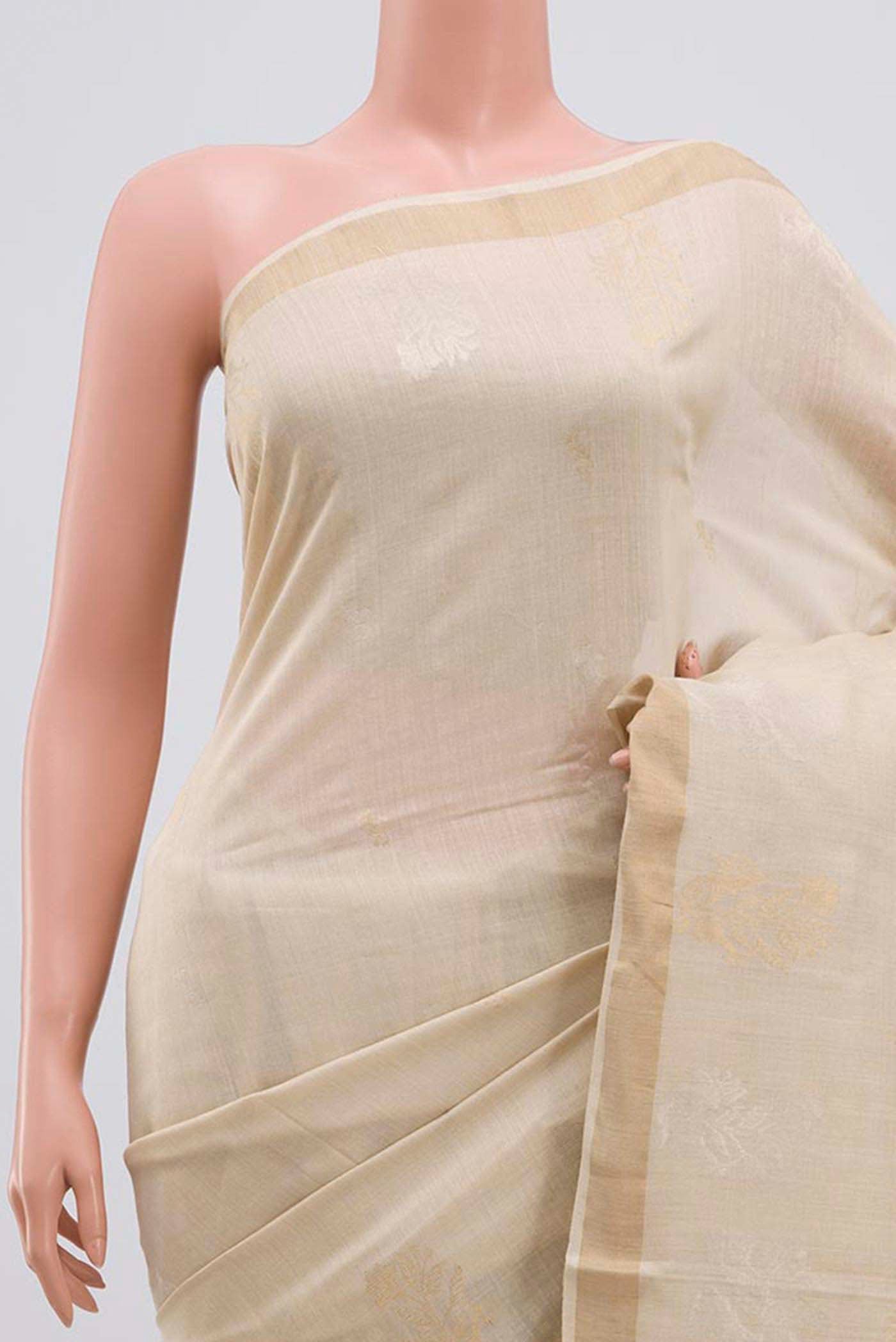 Border image of Cream Tussar Silk Saree with Zari Butta on the body and Zari Border