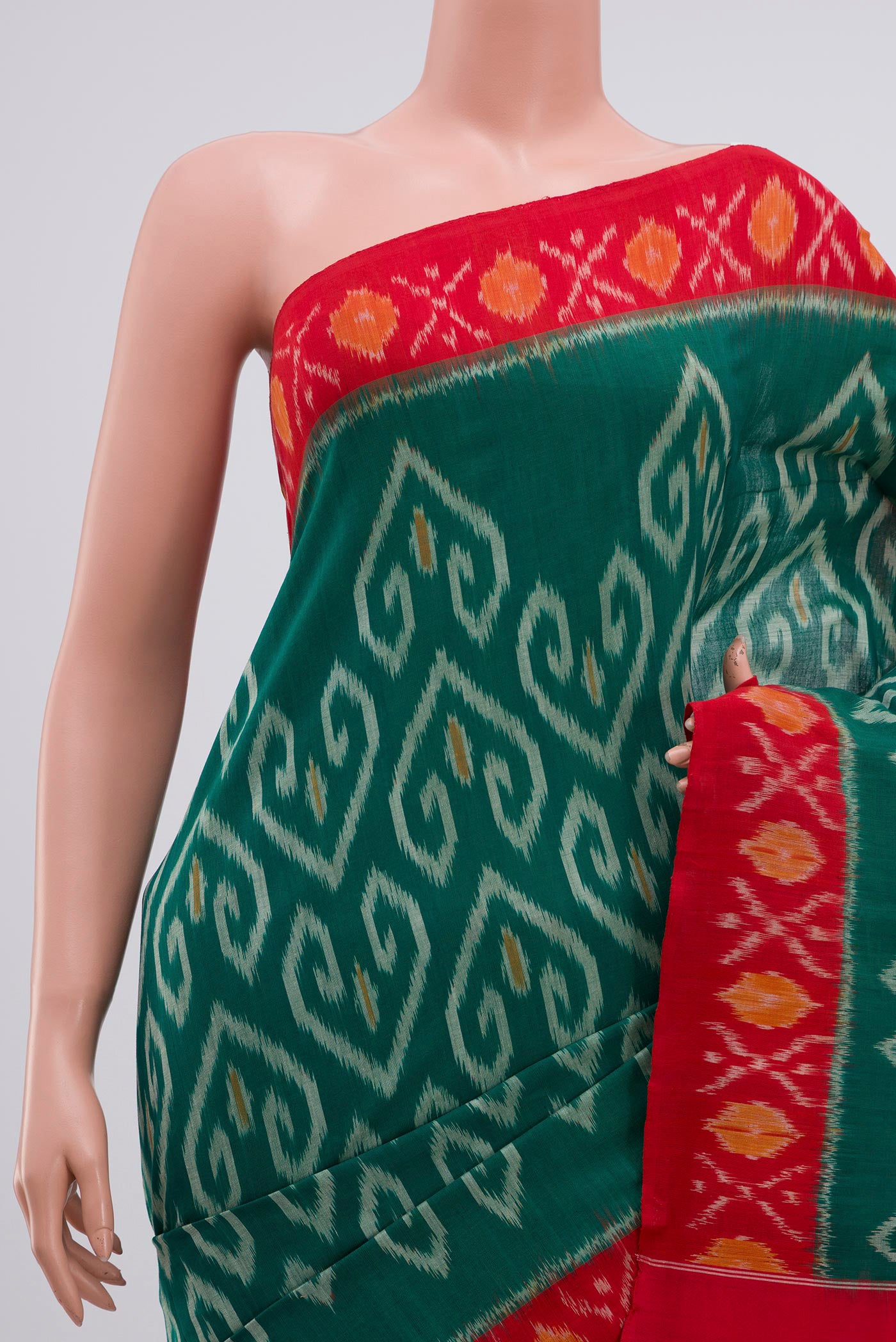 Border image of Green Pochampally Cotton Saree with Ikat design on the body and Ikat Border. 