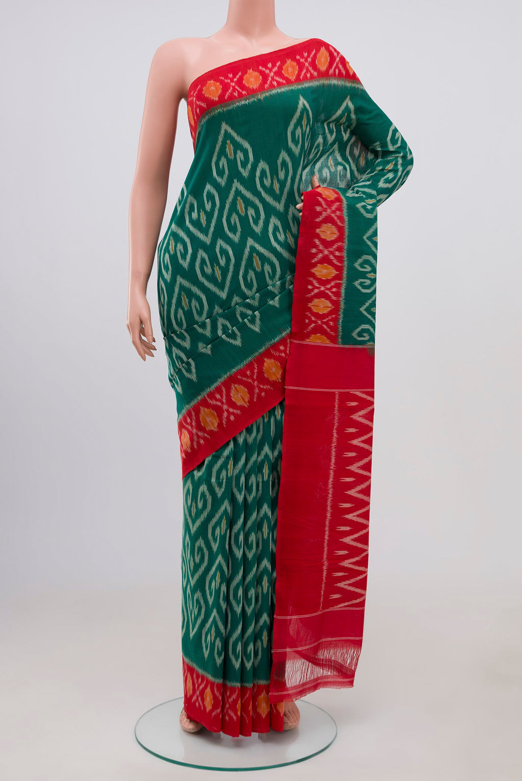 Green Pochampally Cotton Saree with Ikat design on the body and Ikat Border.  displayed on a mannequin