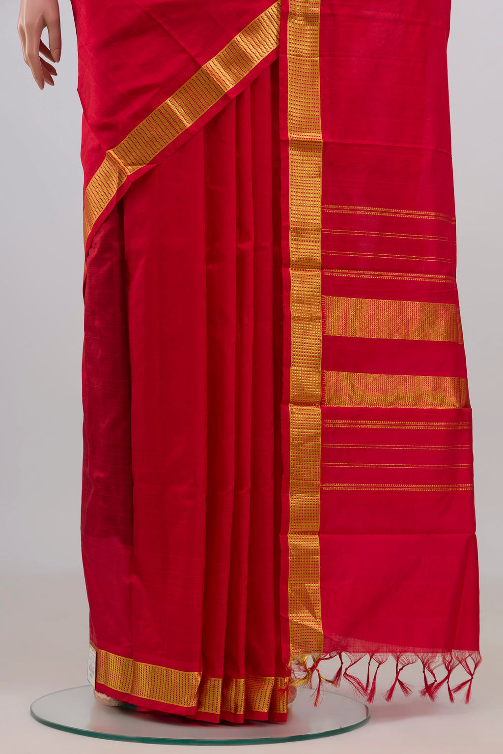 Pleats and pallu of Pure Silk Red Kanjivaram Saree with Plain Body and Zari Border. 