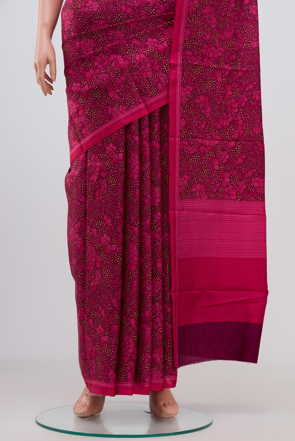 Pleats and pallu of Brown Printed Silk Saree with Printed design on the body and Plain Border. 