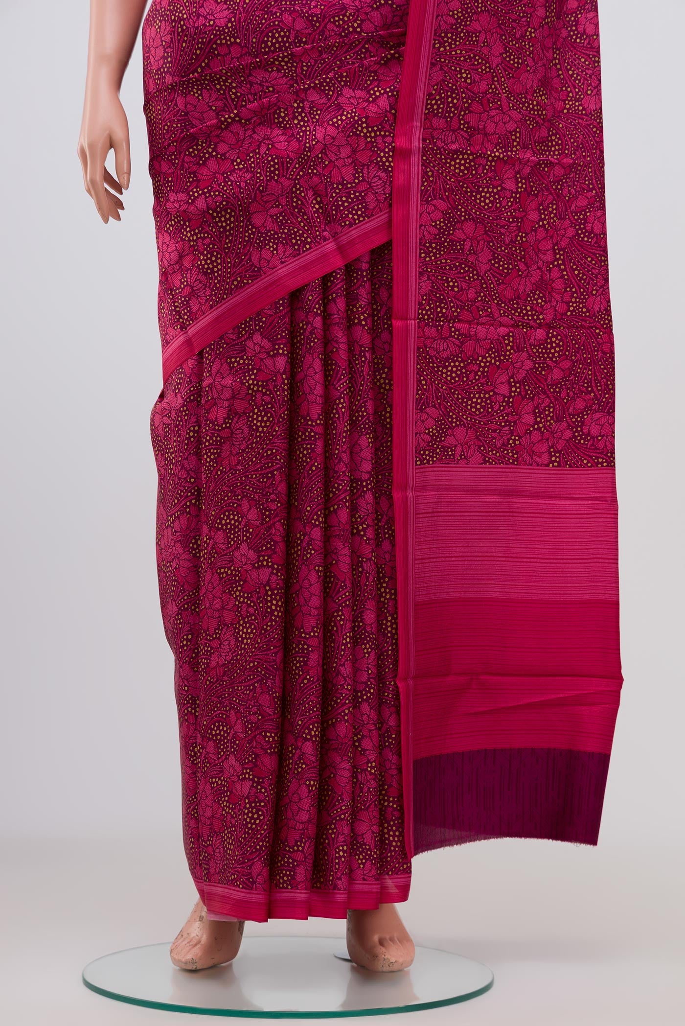 Pleats and pallu of Brown Printed Silk Saree with Printed design on the body and Plain Border. 