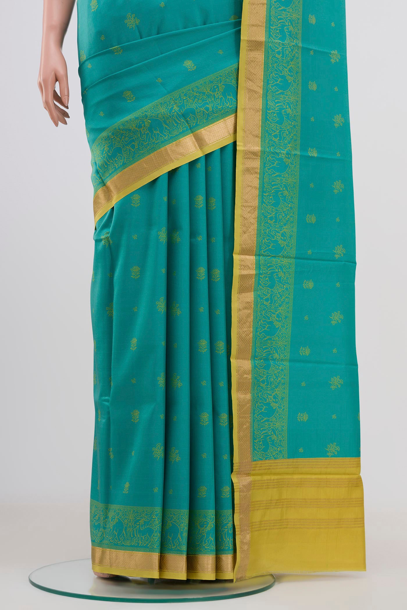 Pleats and pallu of Blue Printed Silk Saree with Printed design on the body and Zari Border. 