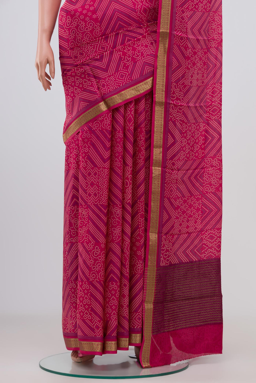Pleats and pallu of Pink Crepe Saree with Printed design on the body and Zari Border. 