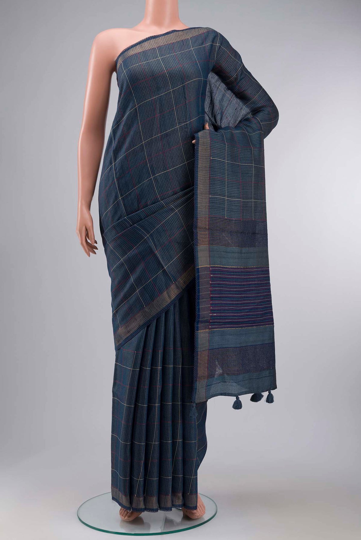 Blue Bhagalpuri Tussar Silk Saree with Checked design on the body and Zari Border displayed on a mannequin