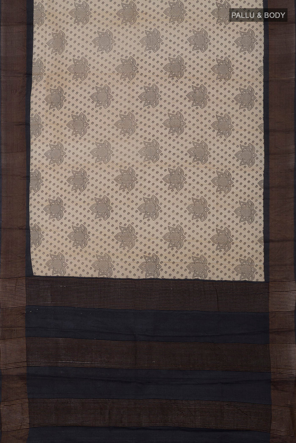 Flat view of Cream Tussar Silk Saree with Printed design on the body and Zari Border. 