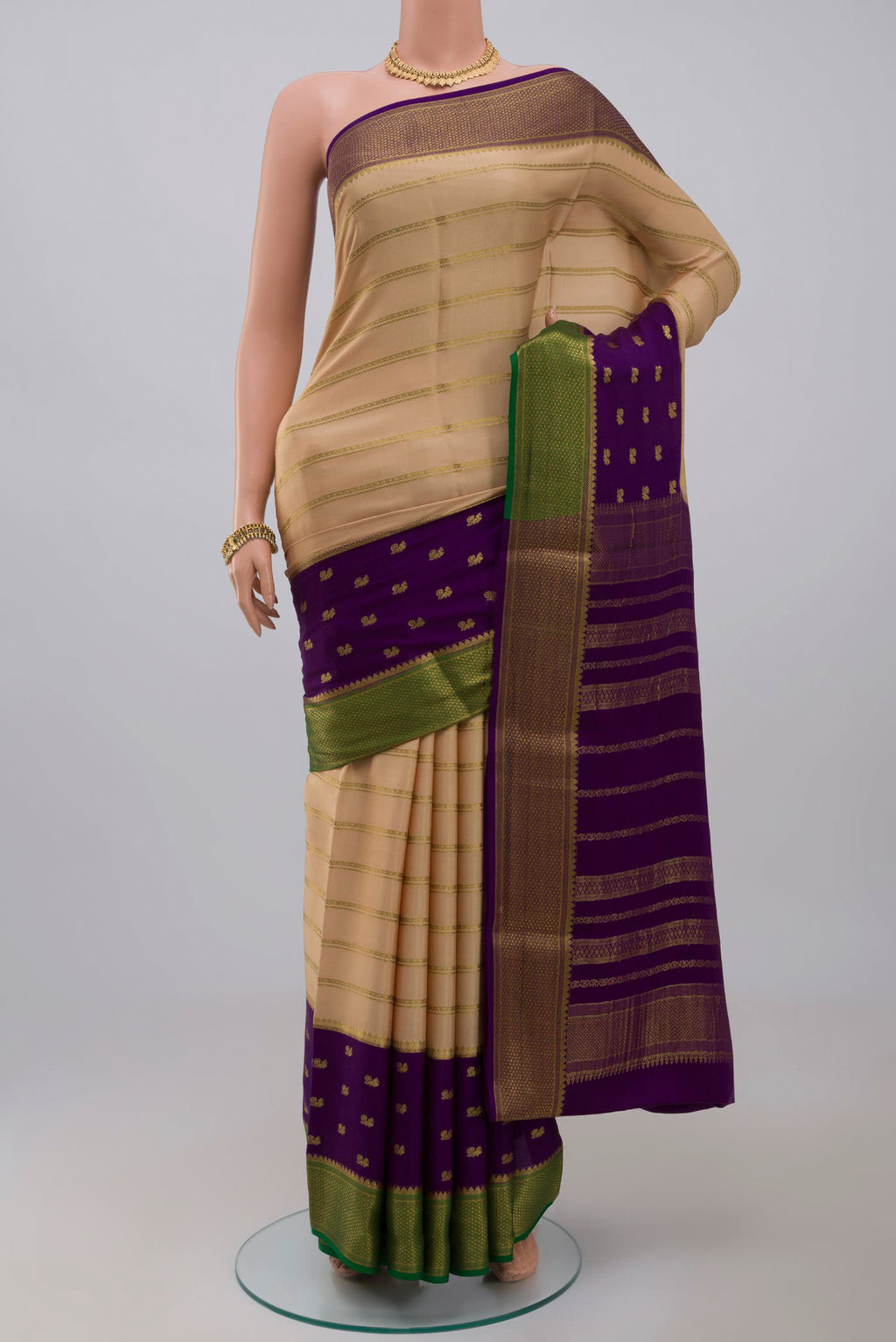 Cream Crepe Saree with Stripes on the body and Zari Border.  displayed on a mannequin