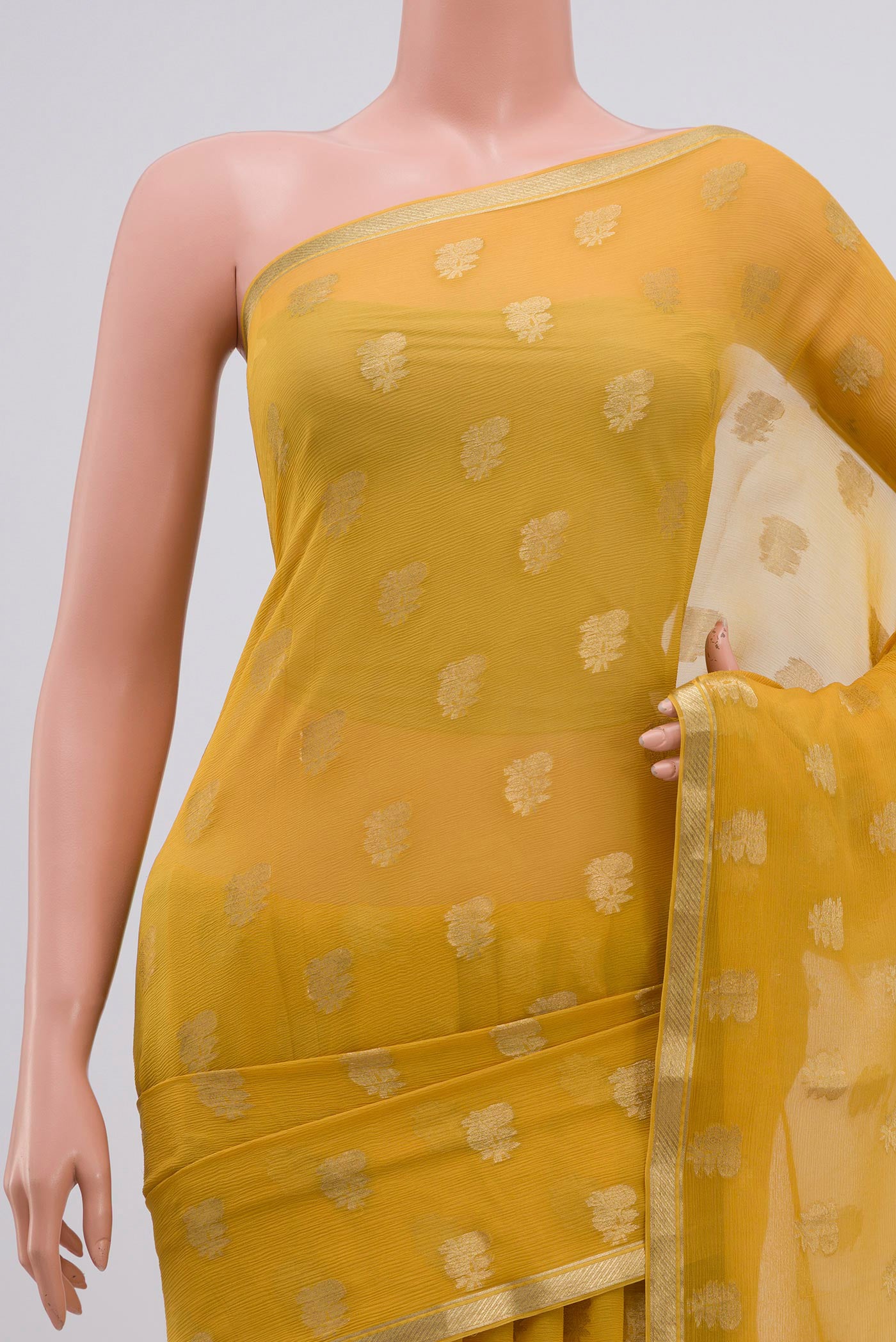 Border image of Yellow Chiffon Saree with Zari Butta on the body and Zari Border. 