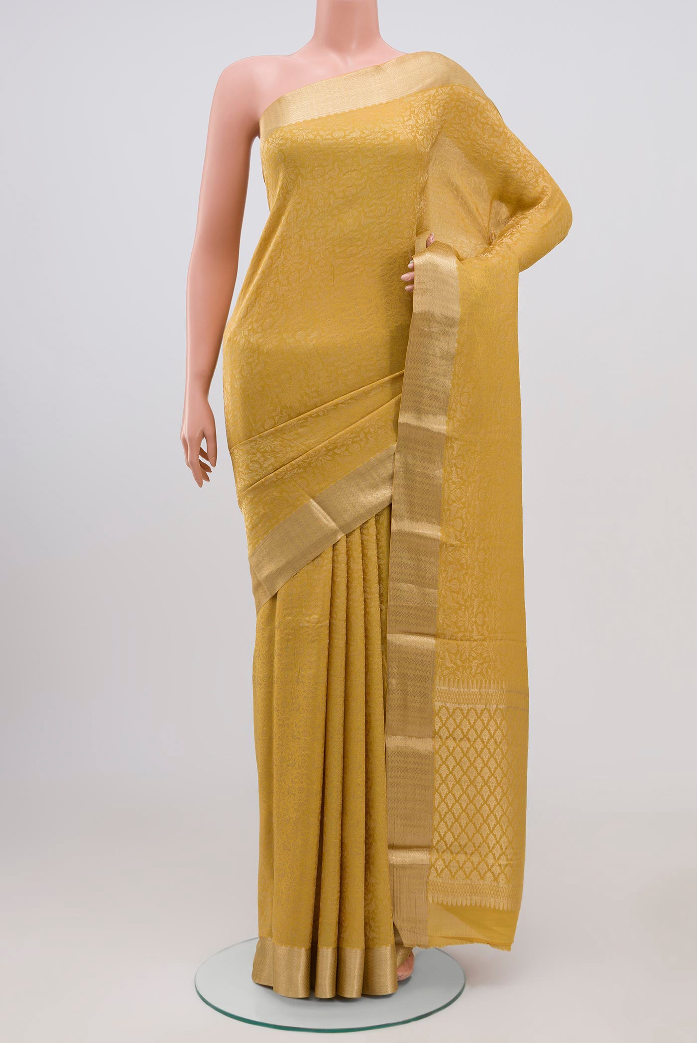 Yellow Mysore Silk Saree with Zari Brocade on the body and Zari Border.  displayed on a mannequin