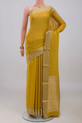 Yellow Mysore Crepe Saree with Jacquard With Zari Butta on the body and Zari Border.  displayed on a mannequin