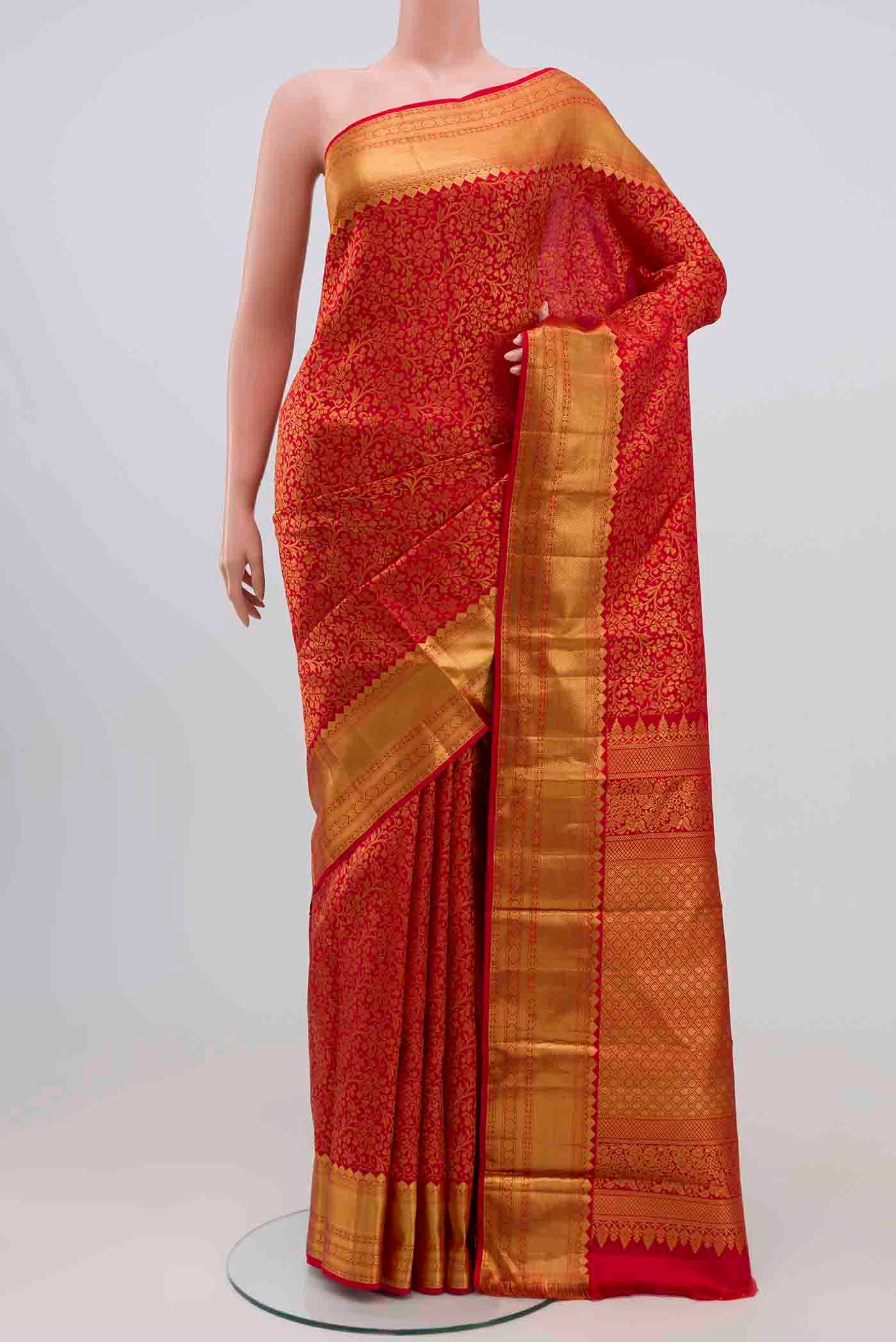 Red Kanjivaram Silk Saree with Zari Brocade on the body and Zari Border.  displayed on a mannequin
