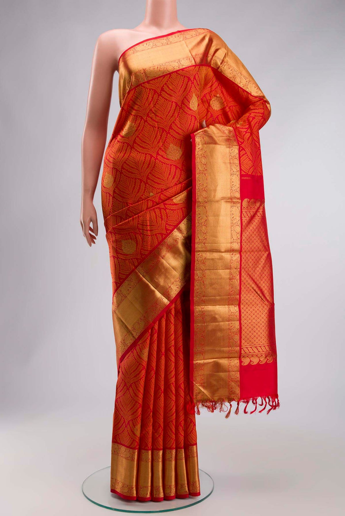 Red Kanchipuram Silk Saree with Jacquard With Zari Butta on the body and Zari Border displayed on a mannequin