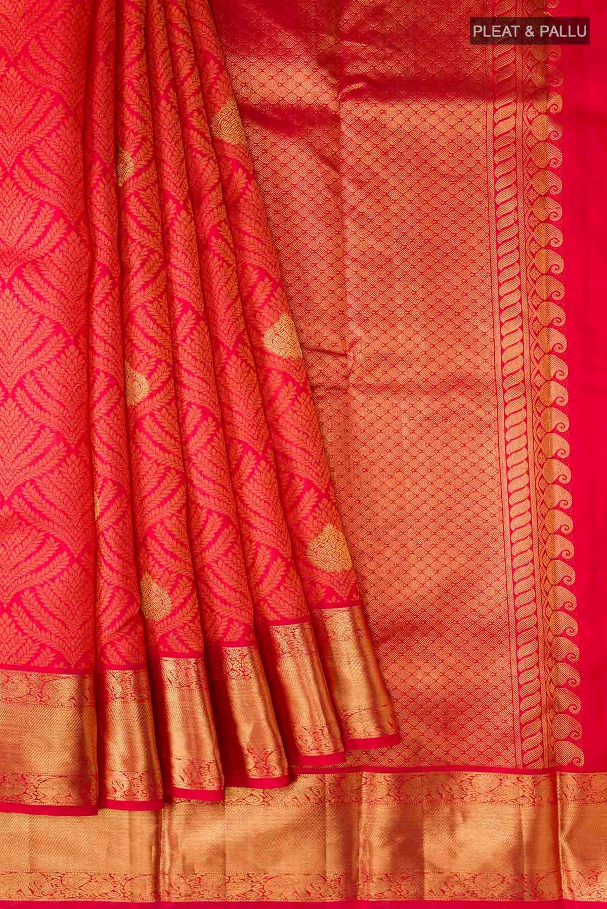 Pleats and pallu of Red Kanchipuram Silk Saree with Jacquard With Zari Butta on the body and Zari Border