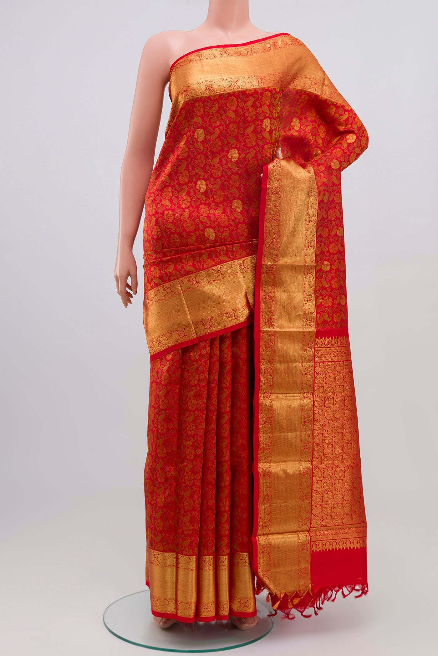 Pure Silk Pure Zari Red Kanchipuram Saree with Jacquard With Zari Butta on the body and Zari Border.  displayed on a mannequin