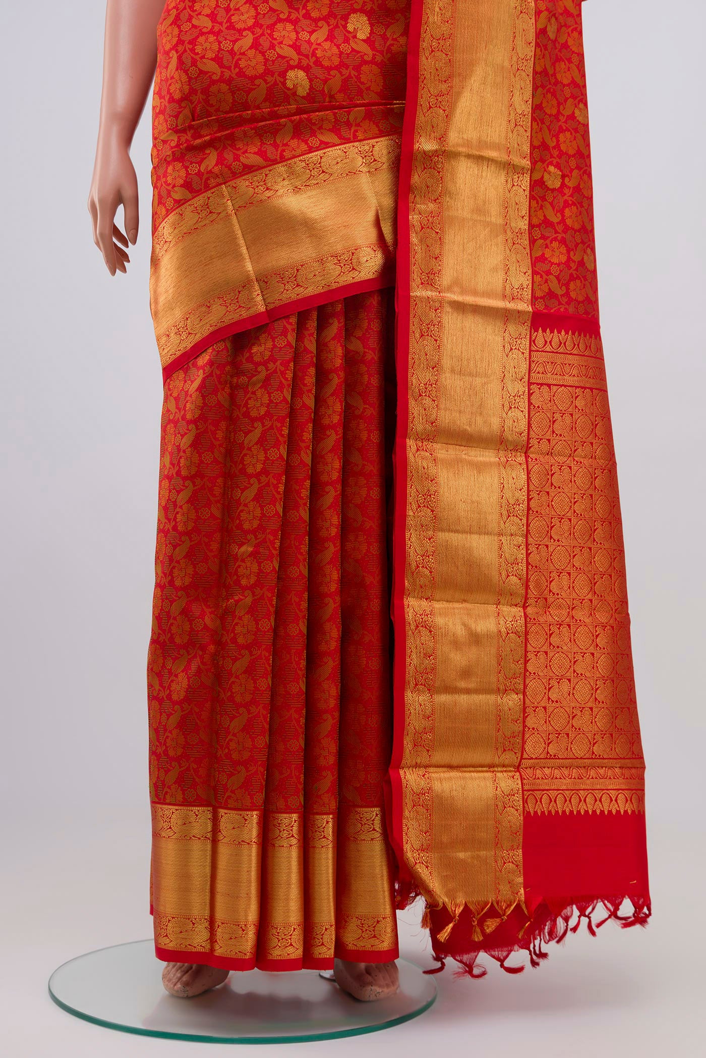 Pleats and pallu of Pure Silk Pure Zari Red Kanchipuram Saree with Jacquard With Zari Butta on the body and Zari Border. 