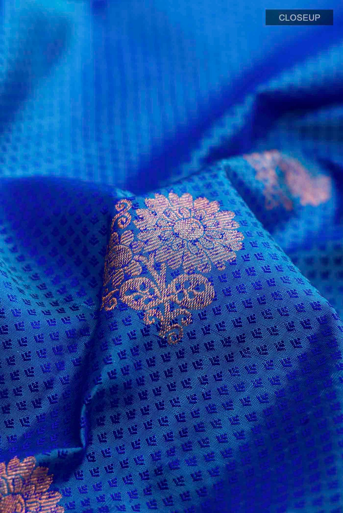 Close up of Blue Kanchipuram Silk Saree with Jacquard With Zari Butta on the body and Zari Border displaying folds