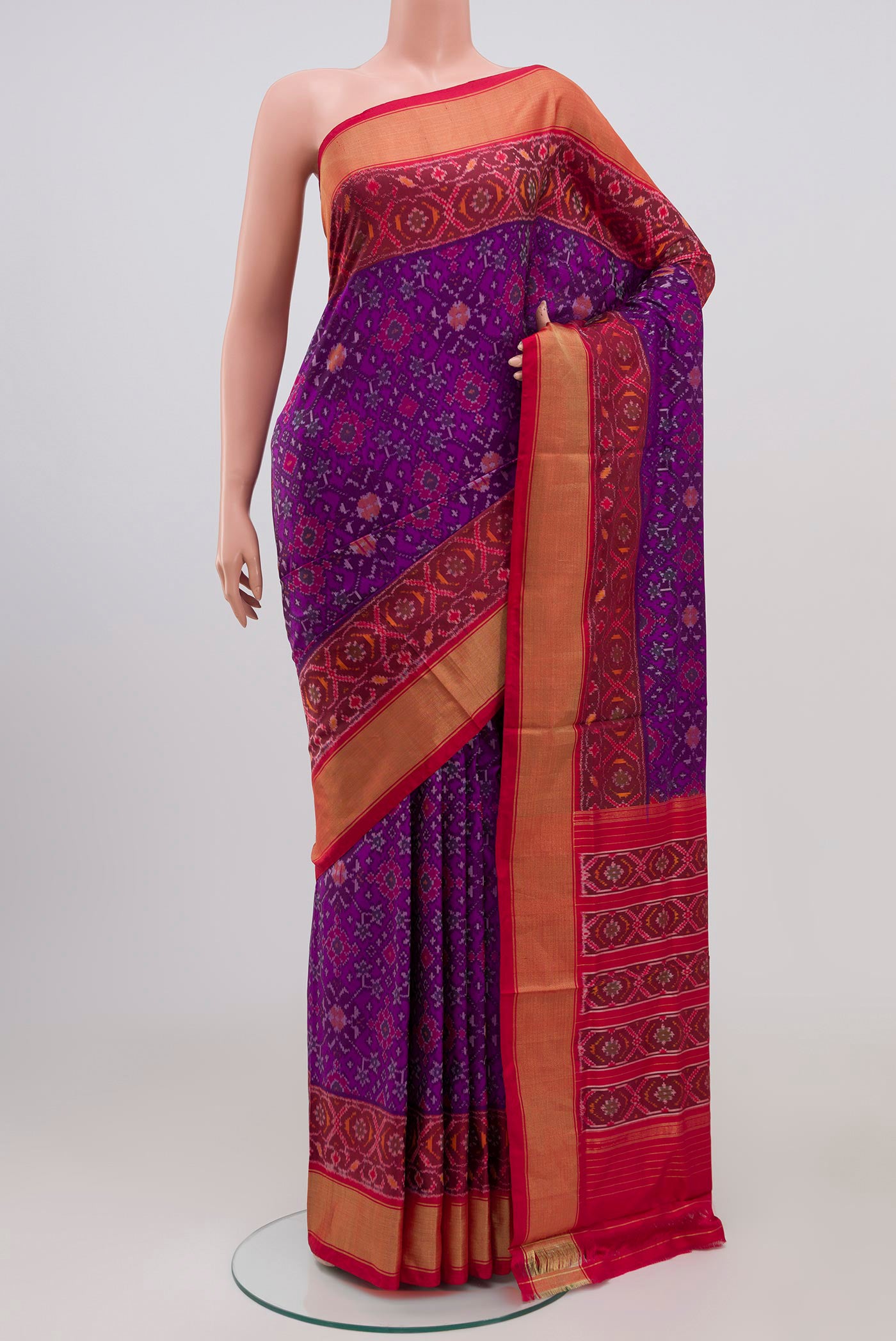 Purple Pochampally Silk Saree with Ikat design on the body and Zari Border.  displayed on a mannequin