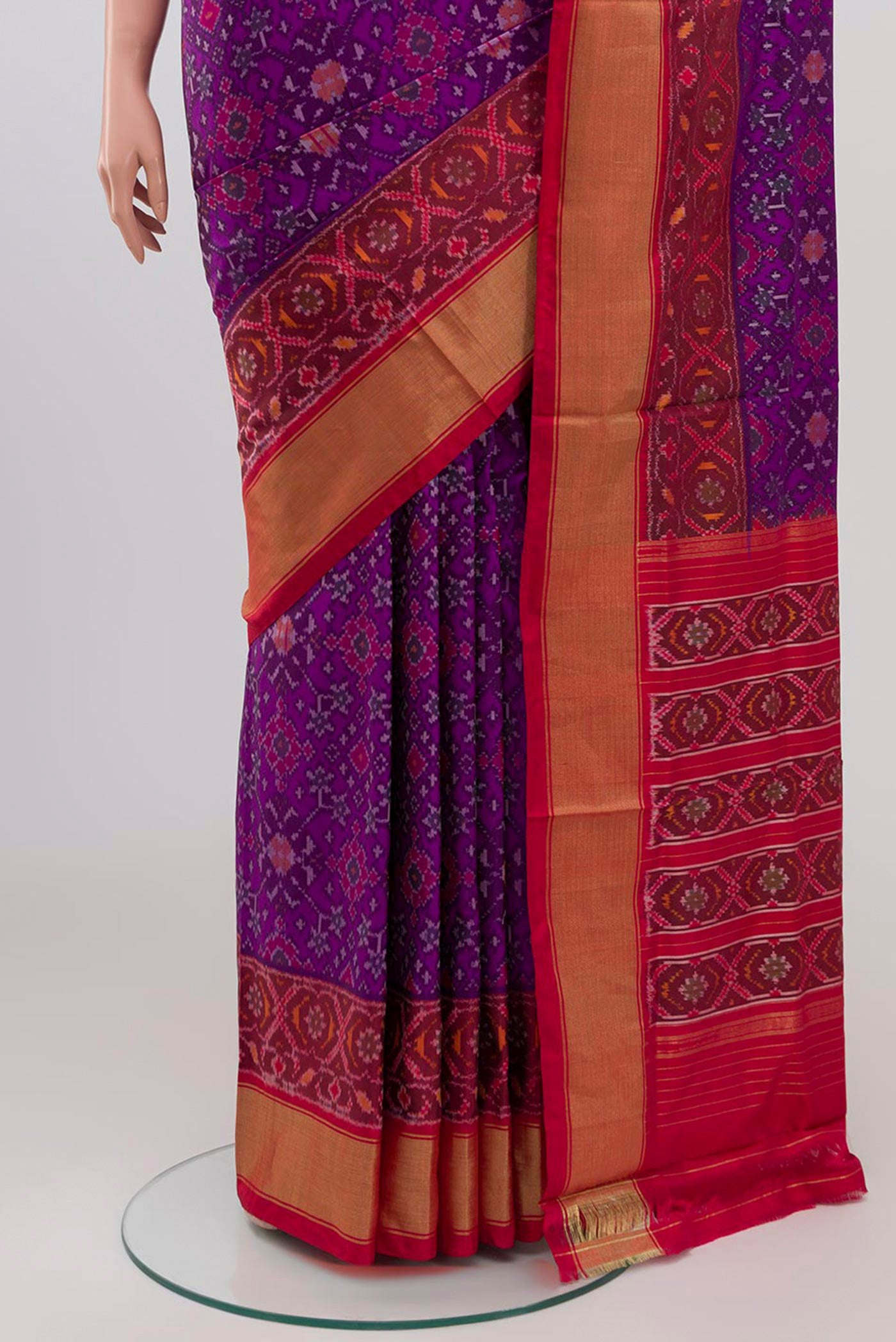 Pleats and pallu of Purple Pochampally Silk Saree with Ikat design on the body and Zari Border. 