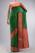 Green Blended Bangalore Silk Saree with Zari Butta on the body and Zari Border displayed on a mannequin