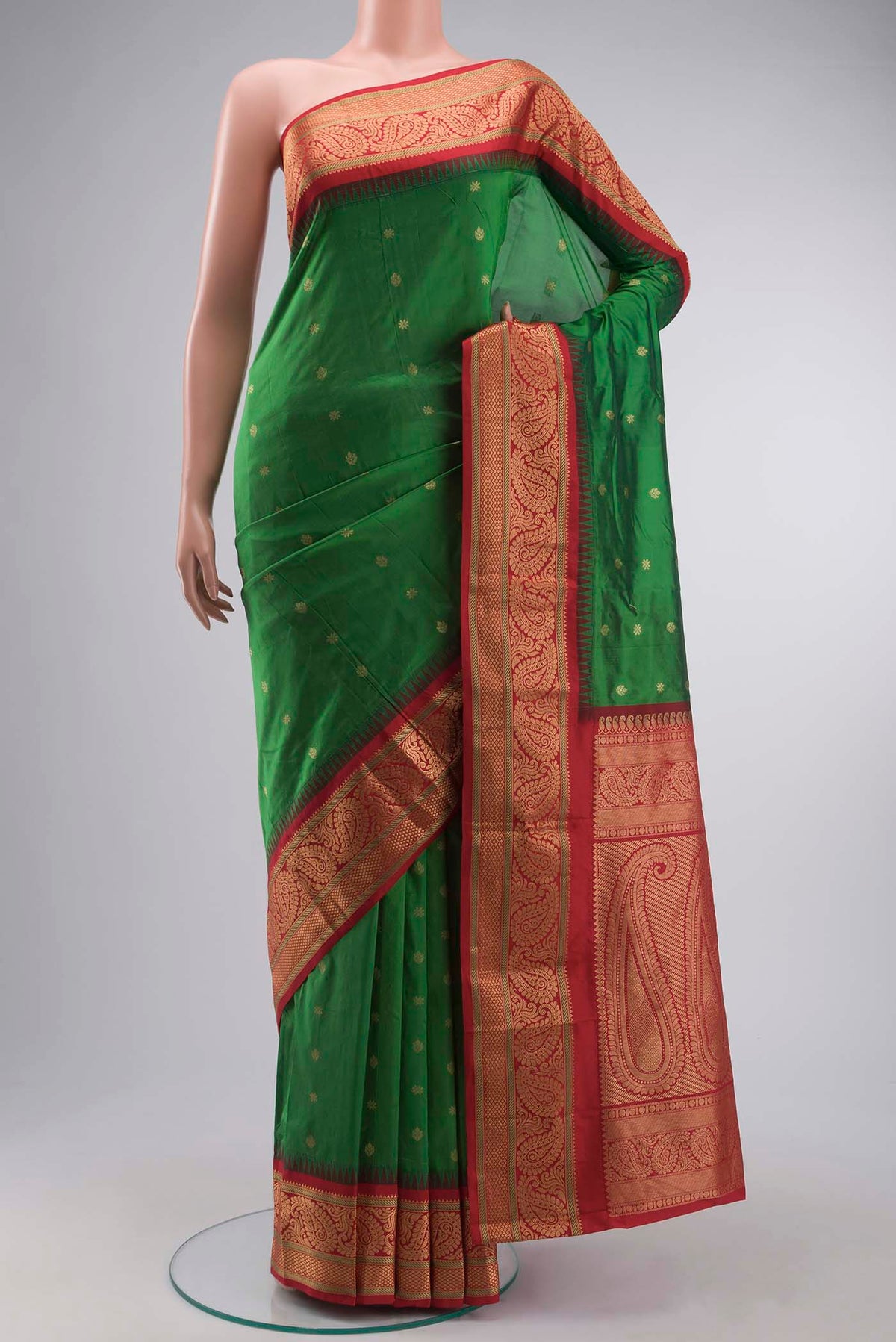Green Blended Bangalore Silk Saree with Zari Butta on the body and Zari Border displayed on a mannequin