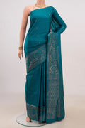 Blue Soft Silk Saree with Zari Butta on the body and Fancy Border.  displayed on a mannequin