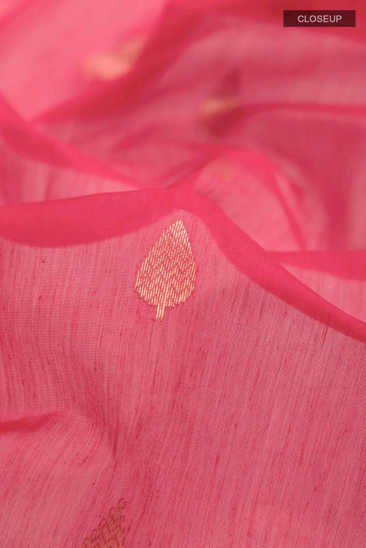 Close up of Red Chanderi Silk Saree with Zari Butta on the body and Zari Border displaying folds