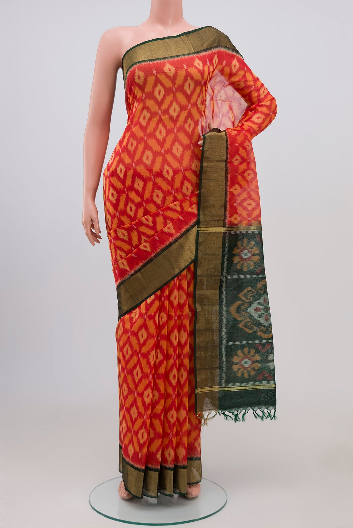 Pink Coimbatore Silk Cotton Saree with Ikat Print on the body and Zari Border.  displayed on a mannequin