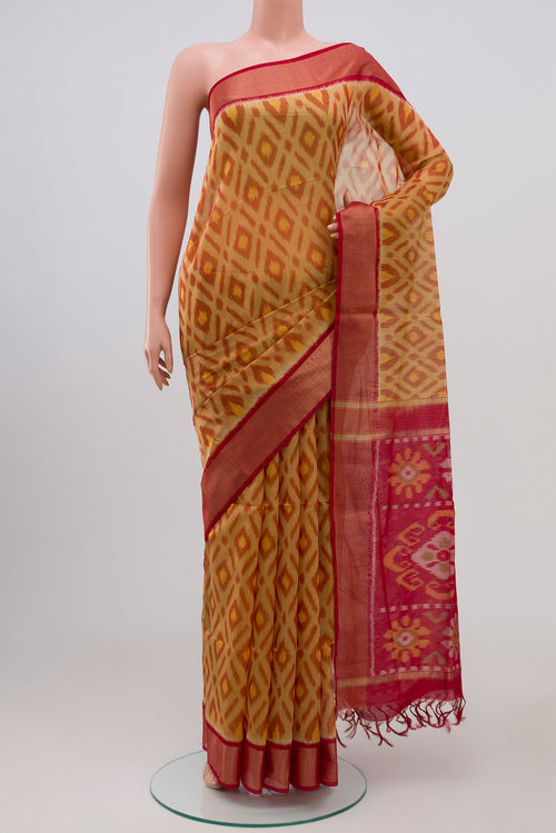 Beige Coimbatore Silk Cotton Saree with Ikat Print on the body and Zari Border.  displayed on a mannequin