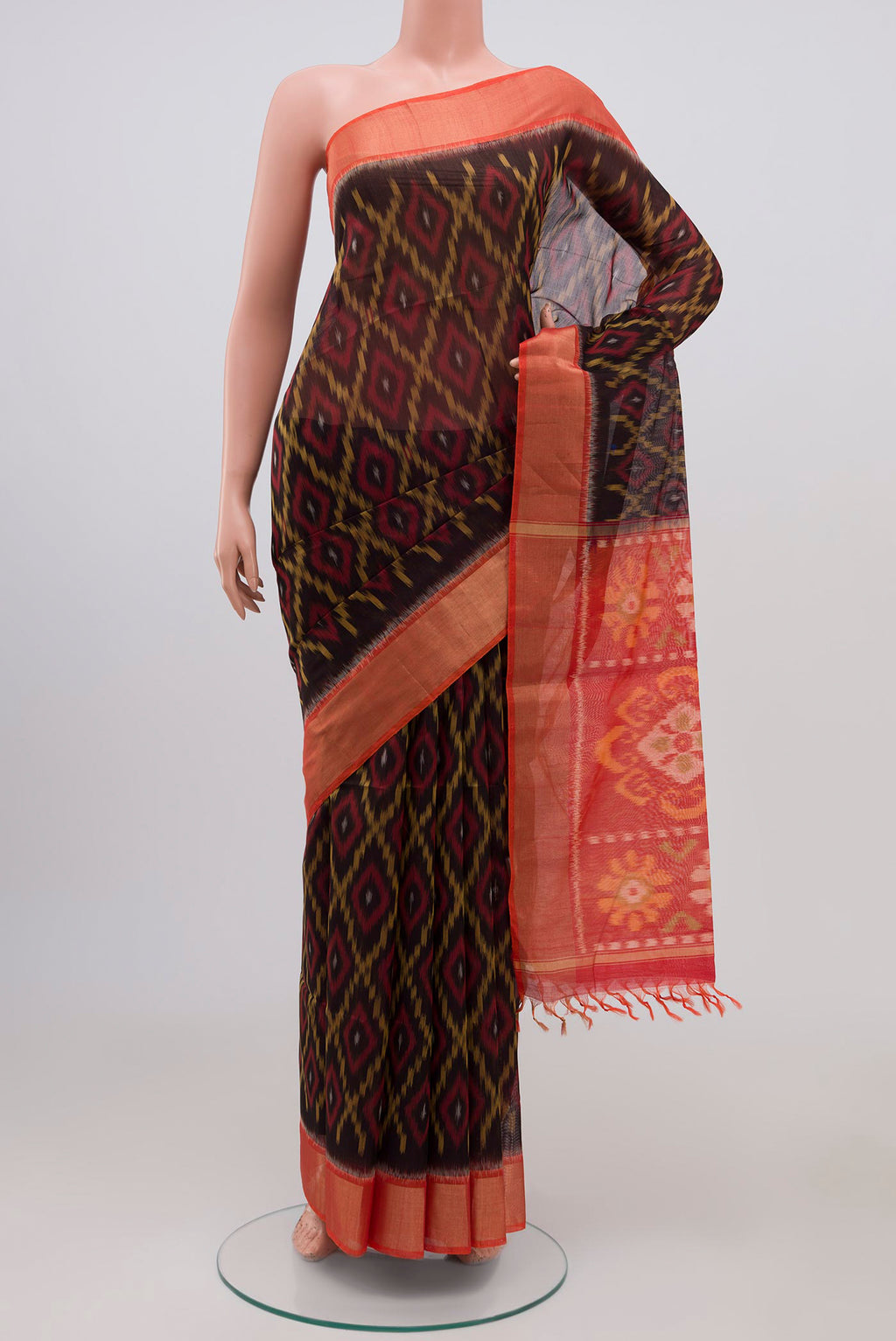 Black Coimbatore Silk Cotton Saree with Ikat Print on the body and Zari Border.  displayed on a mannequin