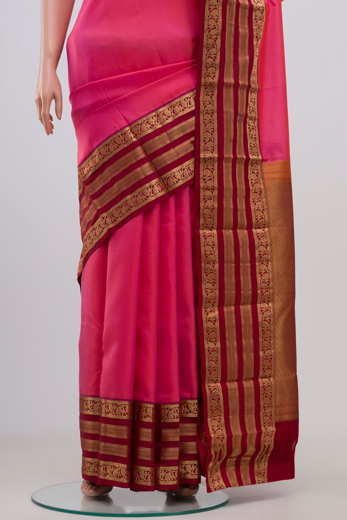 Pleats and pallu of Pink Kanchipuram Silk Saree with Plain Body and Zari Border. 