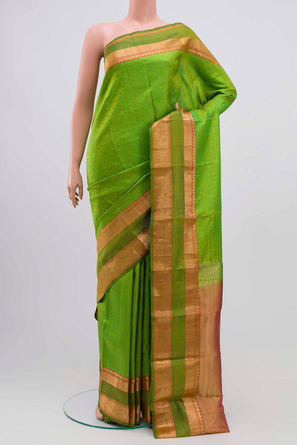 Parrot Green Kanchipuram Silk Saree with Jacquard With Zari Butta on the body and Silk Border displayed on a mannequin