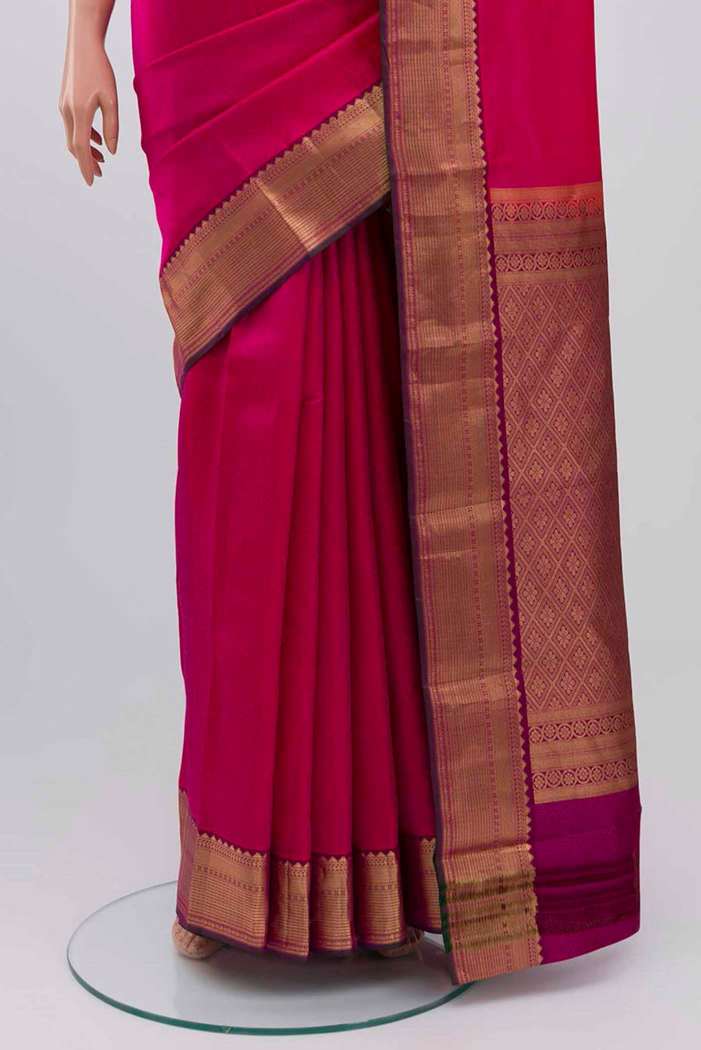 Pleats and pallu of Rani Pink Kanchipuram Silk Saree with Jacquard design on the body and Zari Border