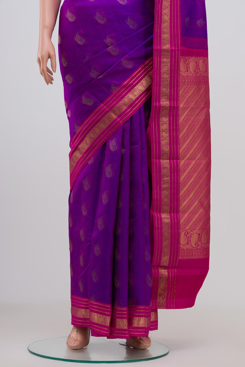 Pleats and pallu of Purple Kanchipuram Saree with Jacquard With Zari Butta on the body and Zari Border. 