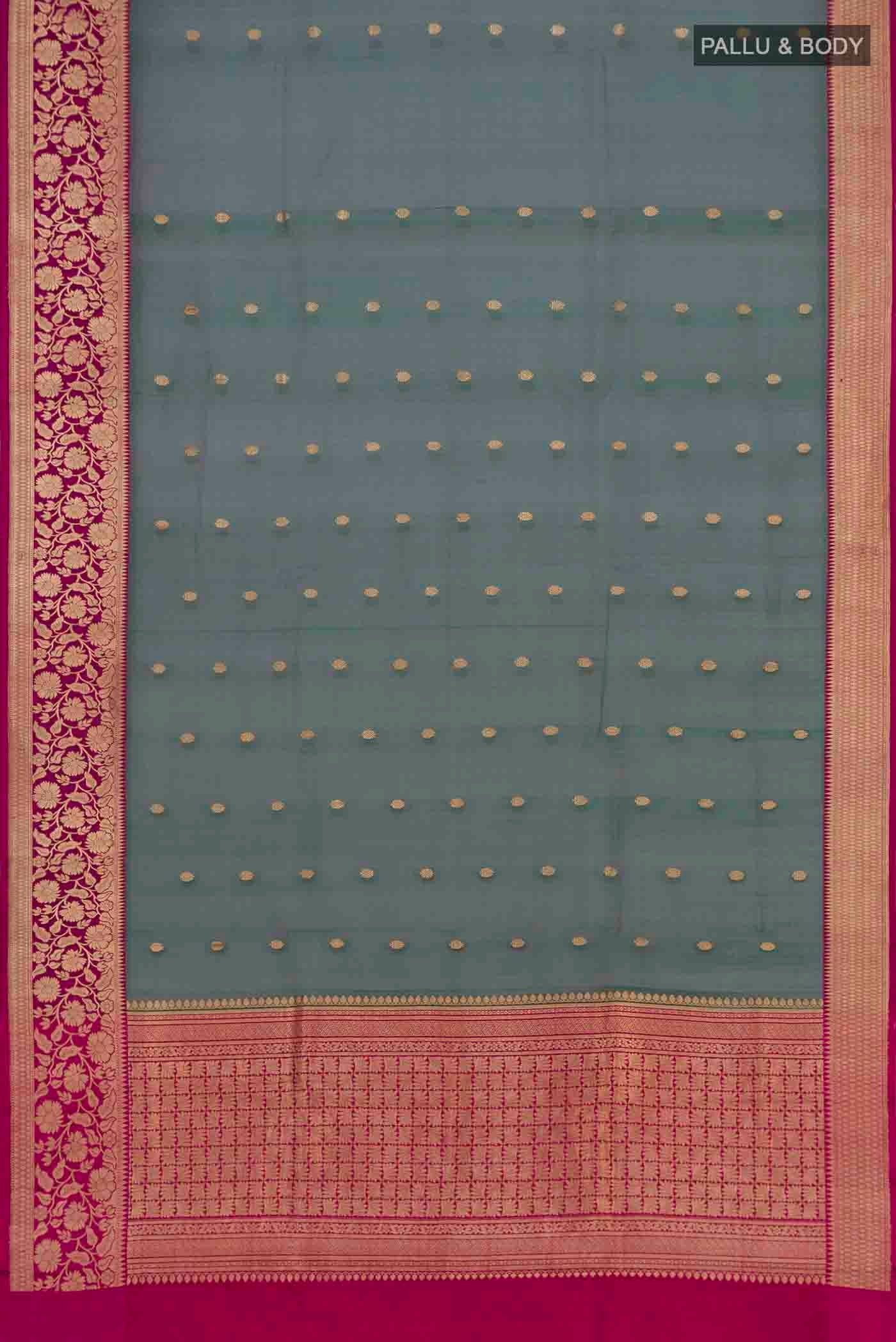 Flat view of Green with Pink Color Banarasi Silk Saree with Zari Butta on the body and Zari Border. 
