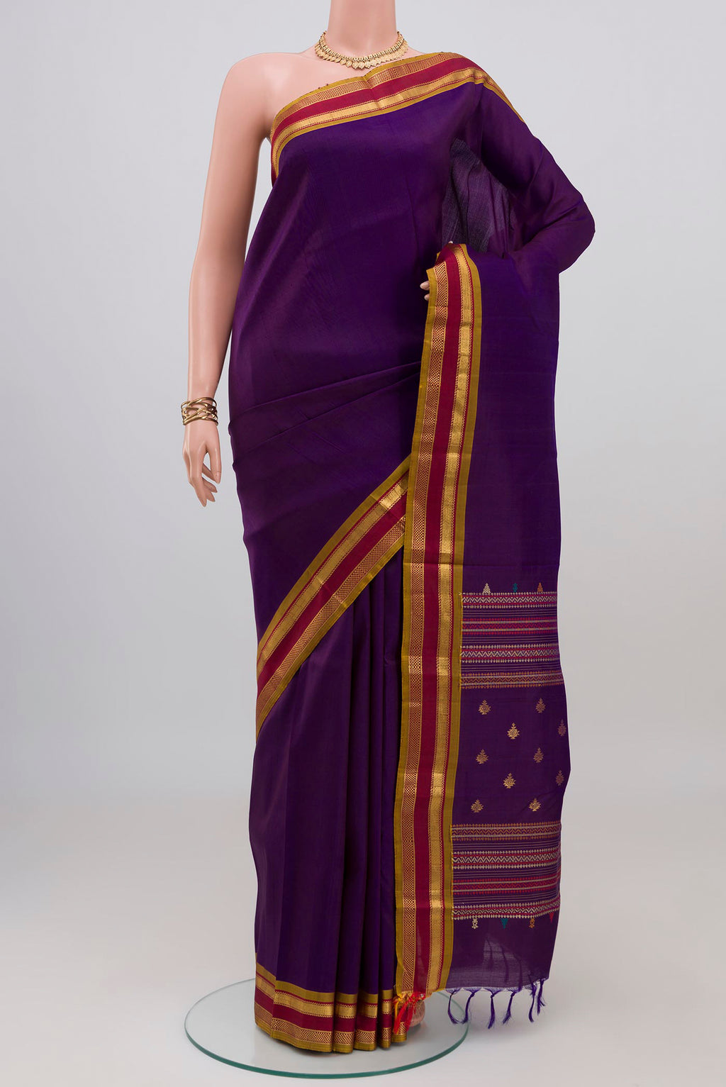Purple Kanjivaram Silk Saree with Plain Body and Zari Border.  displayed on a mannequin