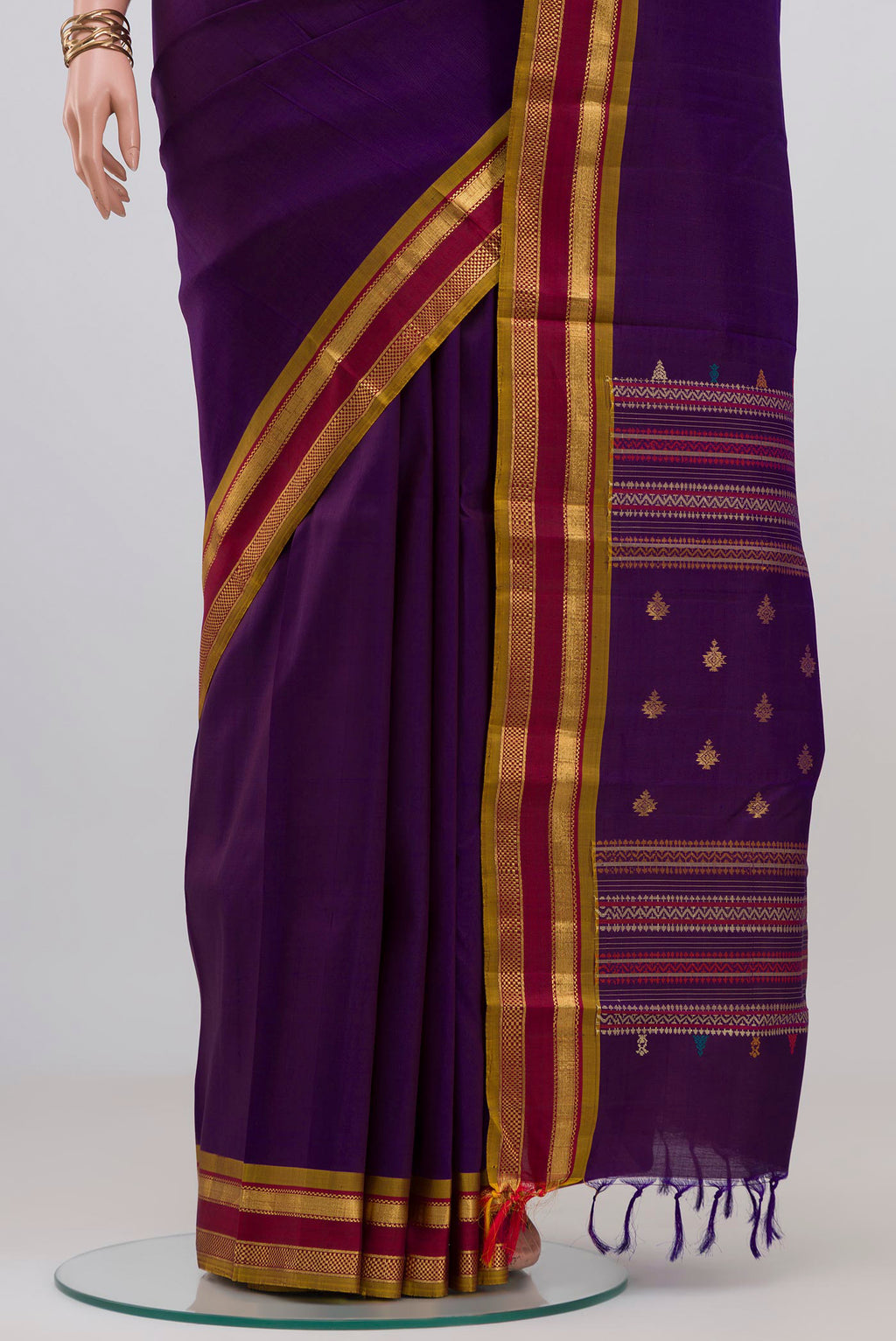 Pleats and pallu of Purple Kanjivaram Silk Saree with Plain Body and Zari Border. 