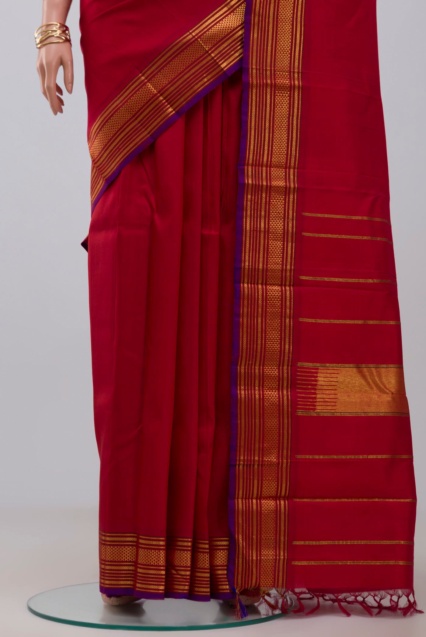 Pleats and pallu of Pure Silk Pure Zari Red Kanjivaram Saree with Plain Body and Zari Border. 