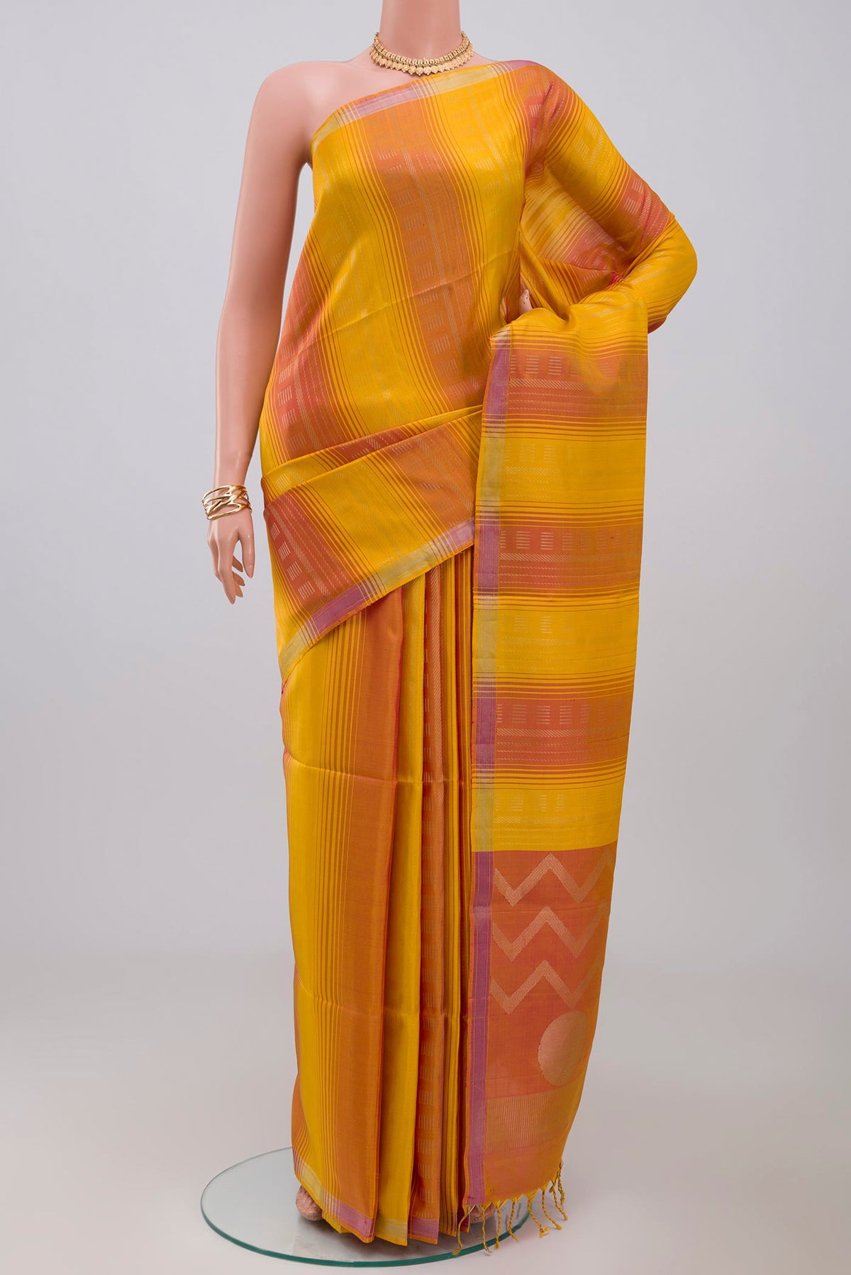 Multi Color Soft Silk Saree with Fancy on the body and Thin Zari Line.  displayed on a mannequin