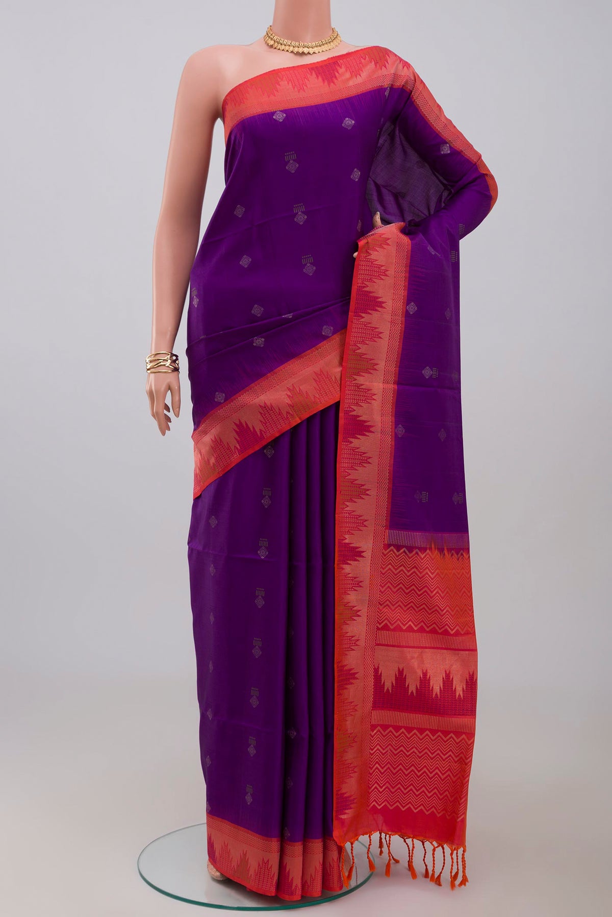 Purple Soft Silk Saree with Zari Butta on the body and Fancy Border.  displayed on a mannequin