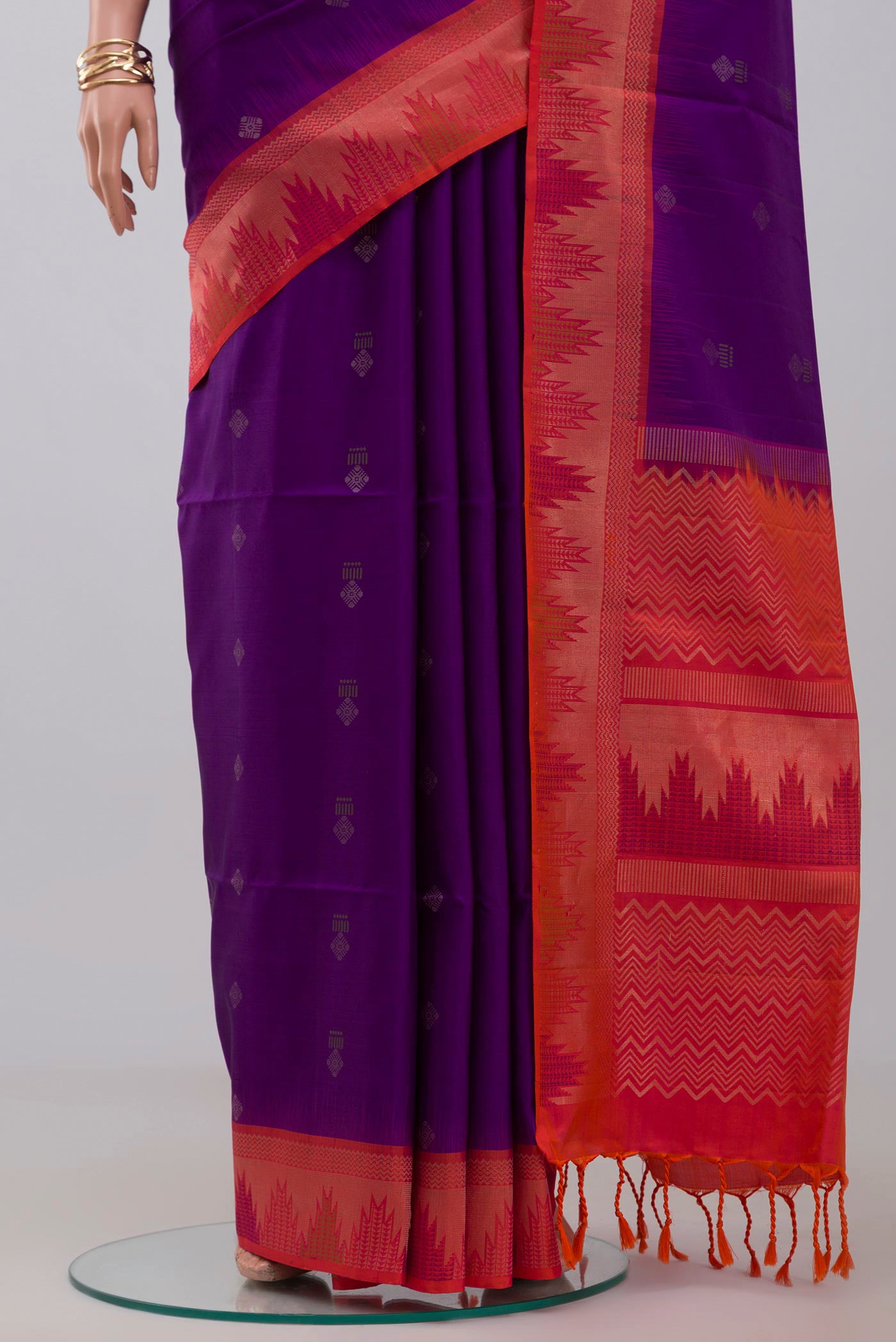 Pleats and pallu of Purple Soft Silk Saree with Zari Butta on the body and Fancy Border. 