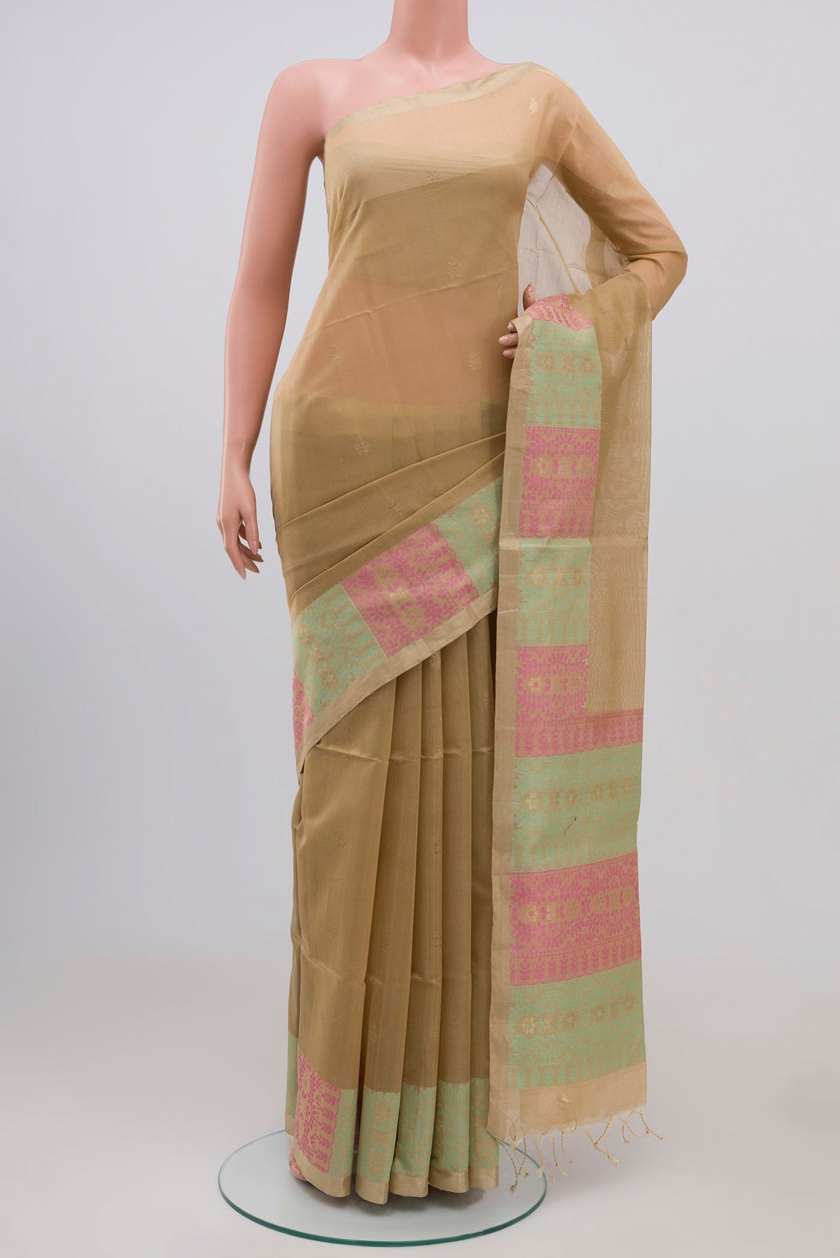 Golden Peach Coimbatore Silk Cotton Saree with Zari Butta on the body and Zari Border.  displayed on a mannequin