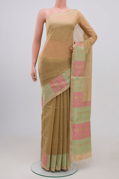 Golden Peach Coimbatore Silk Cotton Saree with Zari Butta on the body and Zari Border.  displayed on a mannequin