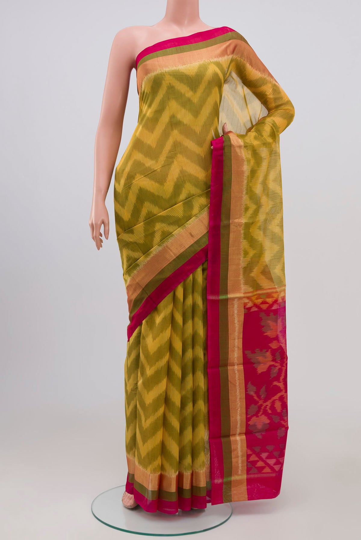 Yellow Coimbatore Silk Cotton Saree with Ikat Print on the body and Zari Border.  displayed on a mannequin