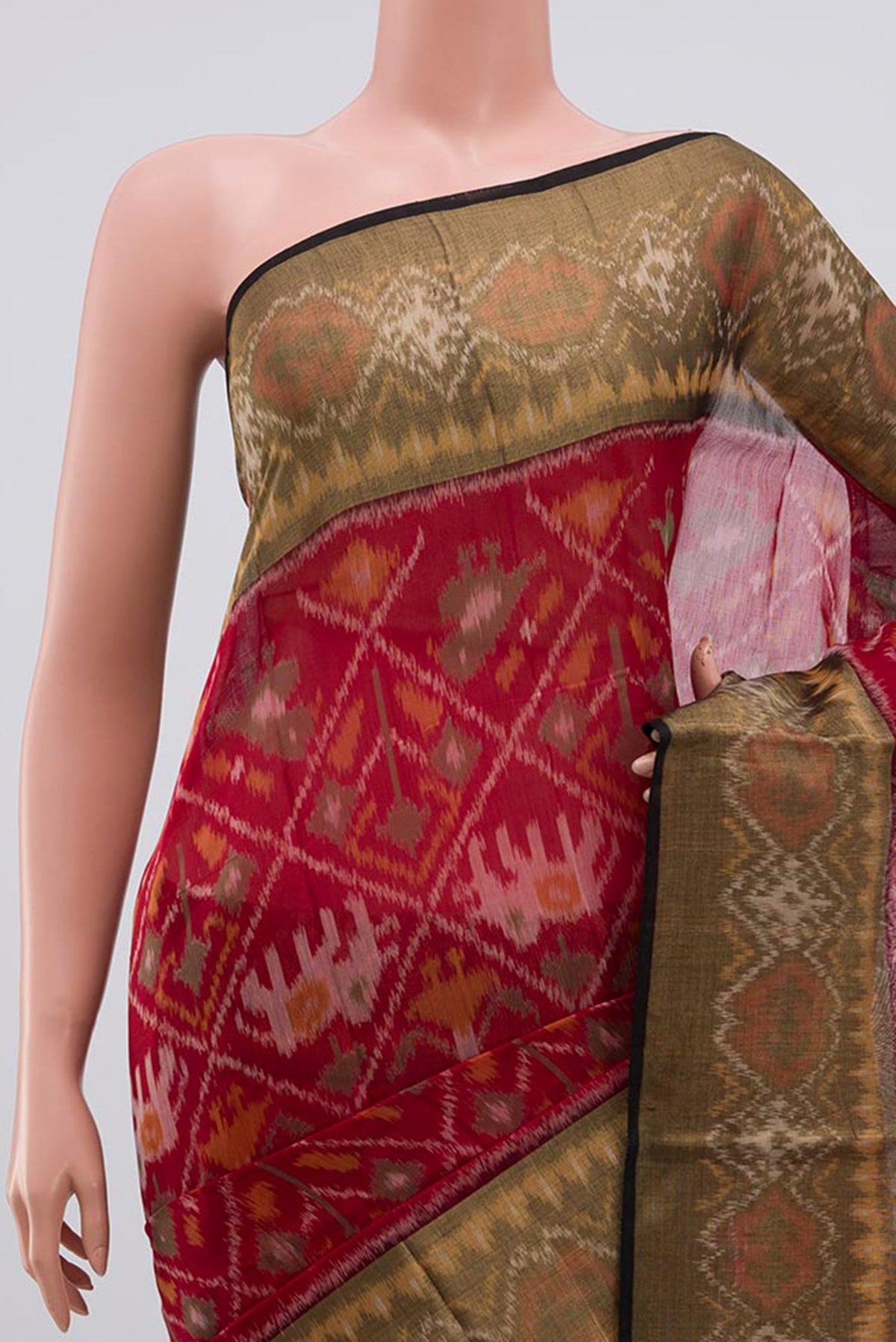 Border image of Red Coimbatore Silk Cotton Saree with Ikat Print on the body and Ikat Border. 