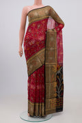 Red Coimbatore Silk Cotton Saree with Ikat Print on the body and Ikat Border.  displayed on a mannequin