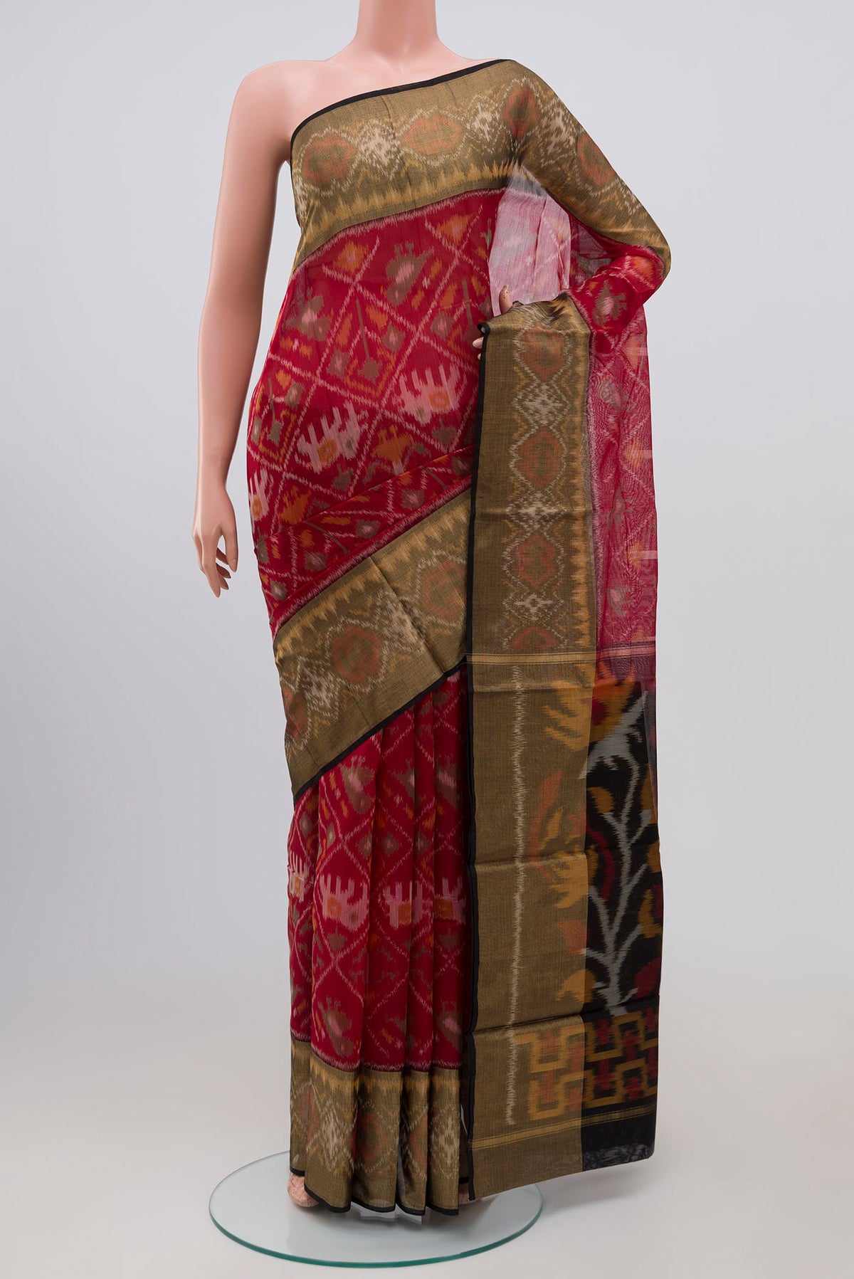 Red Coimbatore Silk Cotton Saree with Ikat Print on the body and Ikat Border.  displayed on a mannequin