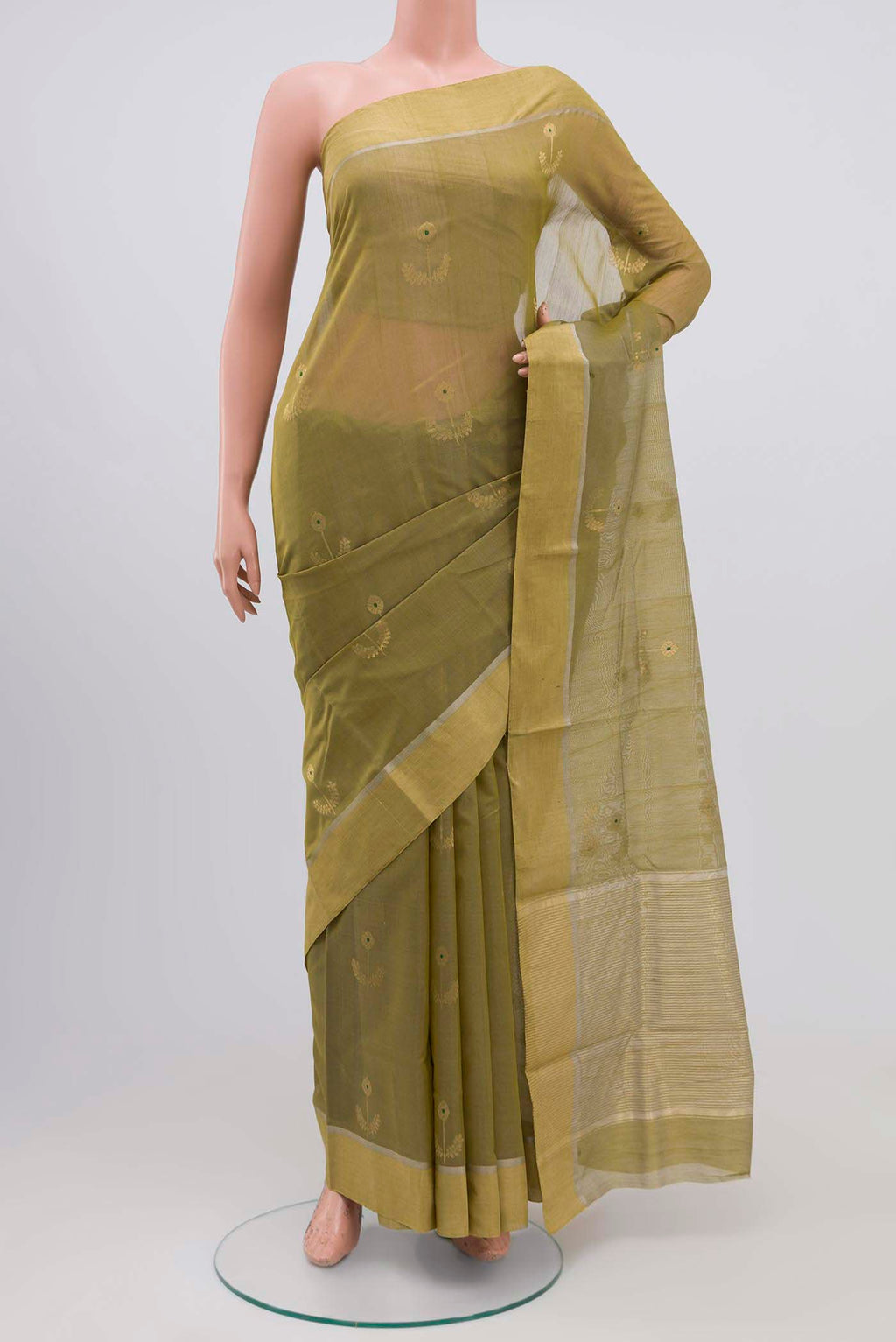 Mehandi Green Chanderi Silk Cotton Saree with Zari Butta on the body and Zari Border.  displayed on a mannequin